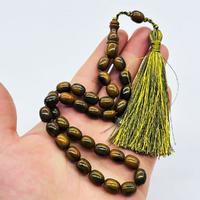 Saçak Püsküllü Koyu Yeşil Renkte Sıkma Ateş Kehribar Tesbih