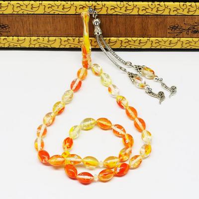 Dalgalı Şeffaf Sarı Kırmızı Tonunda Simli Toz Kehribar Tesbih